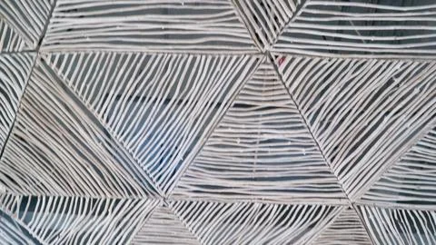 Modern ceiling with geometric pattern of thin gray wooden strips Stock Photos