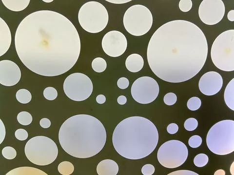 Modern ceiling lamp with many round lights creating a pattern Stock Photos
