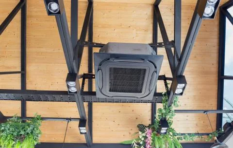 Modern ceiling mounted cassette type air conditioning system in coffee shop Фото