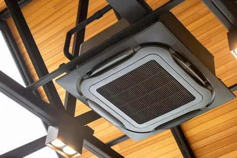 Modern ceiling mounted cassette type air conditioning system in coffee shop Фото
