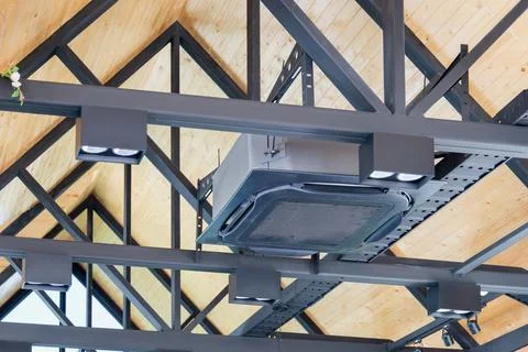 Modern ceiling mounted cassette type air conditioning system in coffee shop Fotos Stock