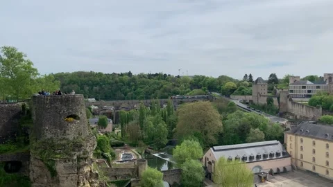 Modern CFL train crosses a bridge and enters a tunnel. Luxembourg City Video stock 308528885