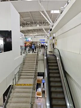 Modern check in counters and spacious terminal interior at Madurai Airport. Stock Photos