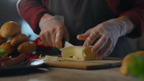 A modern chef in an authentic kitchen prepares food for restaurant visitors. Stock Footage 281426217
