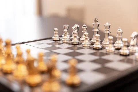 Modern chessboard on a black table Stock Photos
