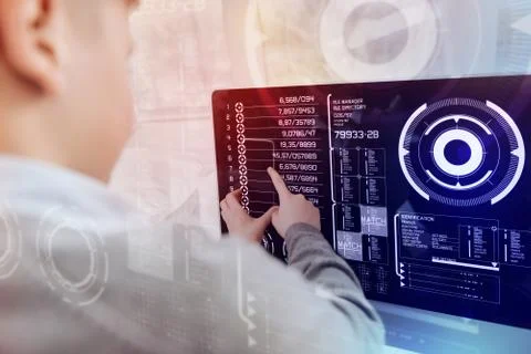 Modern child creating programs while using his computer 写真素材