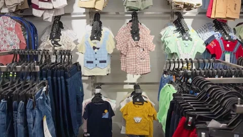 Modern Children's Apparel Store Showcasing Boys Casual Wear and Sale Displays Stock Footage 339480665