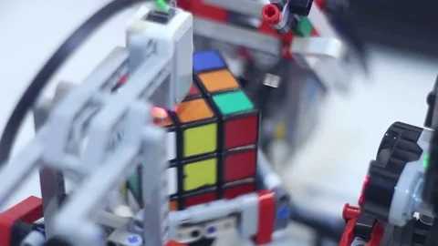 Modern childrens robot assembles the puzzle Stock Footage 81787448