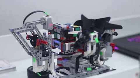 Modern childrens robot with a Rubi's Cube Stock Footage 81787208