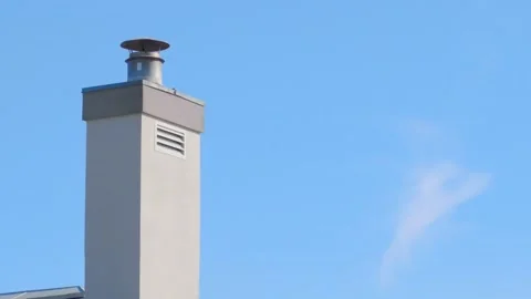 Modern Chimney with Metal Cap Against Clear Blue Sky with Copy Space Stock Footage 345615212