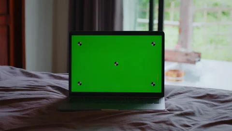 Modern chroma key green screen laptop computer on the bed. Stock Footage 341915529