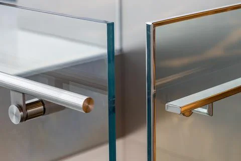 Modern chrome railing with copper end cap in close up 스톡 사진