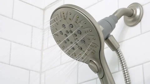 Modern Chrome Shower Head Turning On - Water Spraying in White Tiled Bathroom Stock Footage 331616436
