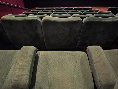 Modern Cinema Auditorium with Rows of Empty Green Seats Stock Photos