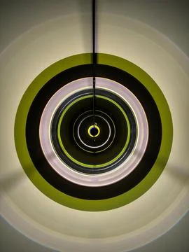 Modern circular pendant light with concentric rings Stock Photos
