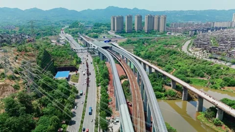 Modern city skyline with elevated railway train and highway in China Stock Footage 330586480