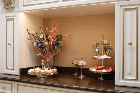 Modern classic kitchen, buffet with sweets for tea or coffee. Foto stock