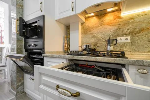 Modern classic white kitchen interior with wooden furniture Stock Photos