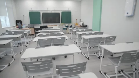 Modern classroom displays neat rows of desks and chairs Vídeos de archivo 335643995