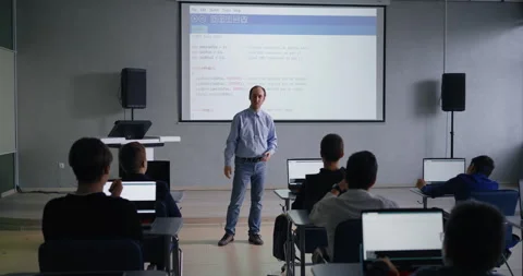 Modern Classroom For Programming And Coding Classes, Male Teacher Communicating Stock Footage 281938307
