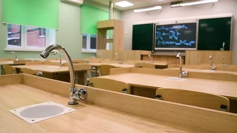 A modern classroom in a school or educational institution. A blackboard wit.. Video stock 339915211