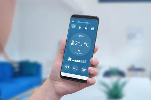 Modern climate control app interface on a smartphone in hand. Concept of simp Stock Photos