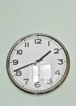 Modern clock on the wall Stock Photos
