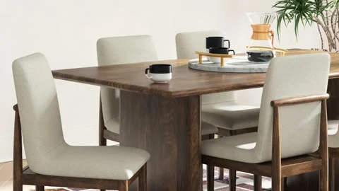 Modern Coastal Dining Table with Coffee Carafe and Chairs Stock Footage 340407613
