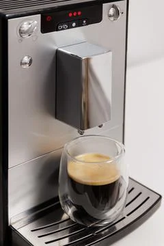 Modern coffee machine with double sided glass cup of espresso Stock-Fotos