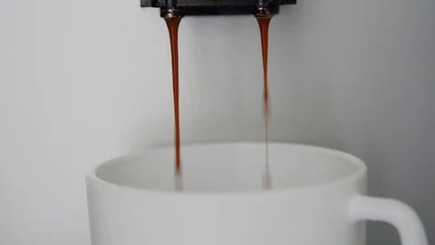 Modern coffee machine pours ready beverage into white cup Stock Footage 114647865