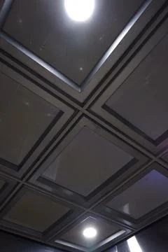 Modern Coffered Grid Ceiling with Purple Ambient Light at Jakarta Residential Stock Photos
