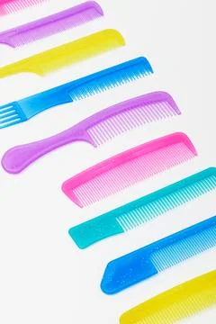 Modern colored combs on white background Foto stock