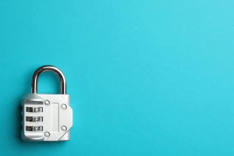 Modern combination lock on light blue background, top view. Space for text Foto stock