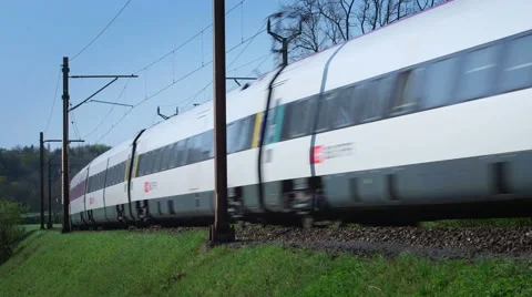 Modern commuter train and wagons at medium speed Stock Footage 49414150