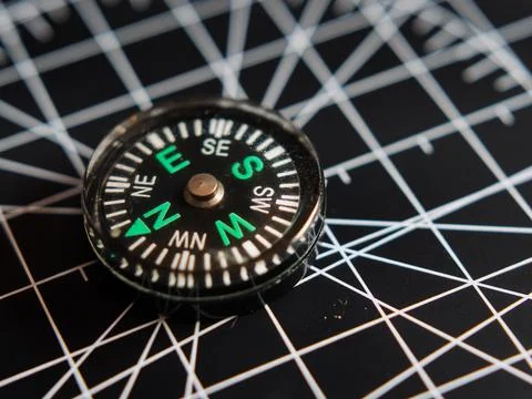 Modern Compass on Geometric Map Background Фото
