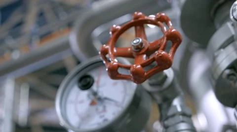 Modern complex technological industrial equipment. A red tap (faucet) Stock Footage 61545525