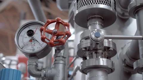 Modern complex technological industrial equipment. A red tap (faucet) Stock Footage 61546169