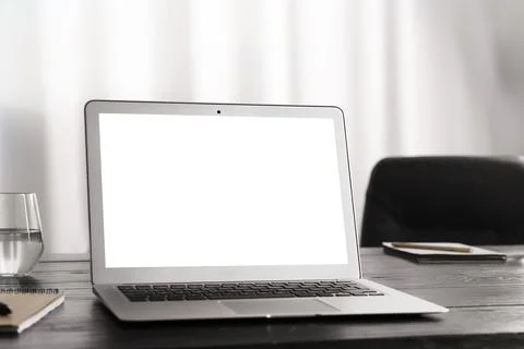 Modern computer with blank screen on table at workplace. Space for design Stock Photos