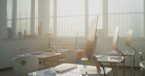 Modern Computer Classroom with White Desks, Chairs and Computer Monitors for Stock Footage 316303332