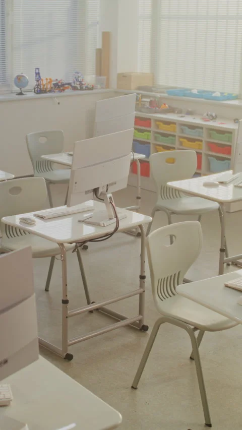 Modern Computer Classroom with White Desks, Chairs and Computer Monitors for Stock Footage 317170867