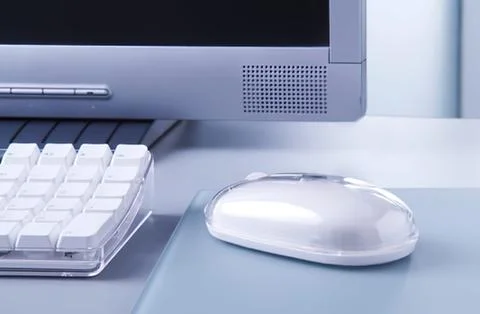Modern computer desk with keyboard and mouse 写真素材