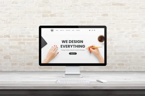 Modern computer display with web design agency page on office, studio desk. F Stock Photos