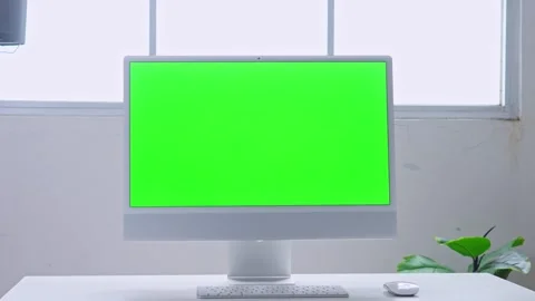 Modern computer with green screen on white desk in office Stock Footage 328553283