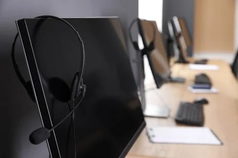 Modern computer with headset in office. Hotline service Foto stock