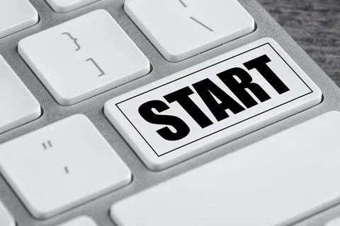 Modern computer keyboard with word START on white button, closeup Stock Photos