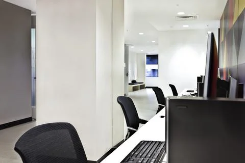 Modern computer lab or office with white walls Foto stock
