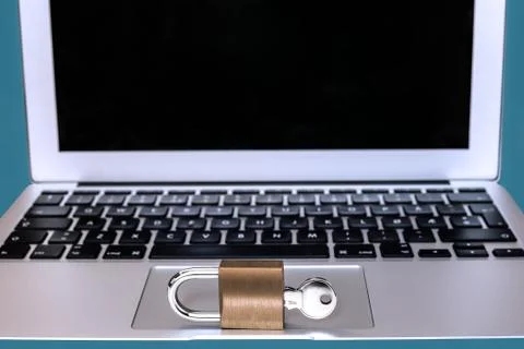 Modern computer with a lock and key in front -  Concept of web security Stock Photos