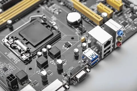 A modern computer motherboard featuring various electronic components Stock Photos