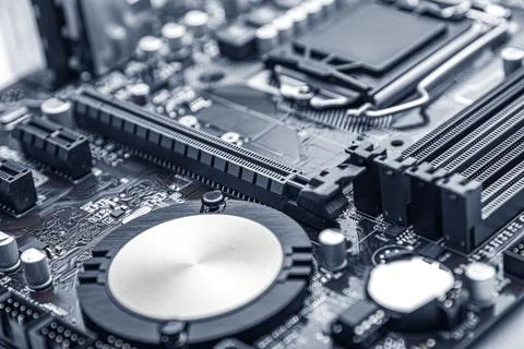 A modern computer motherboard with various electronic components. Stock Photos