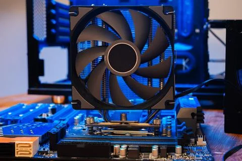 Modern computer parts with PC case on background. Building personal gaming and Stock Photos